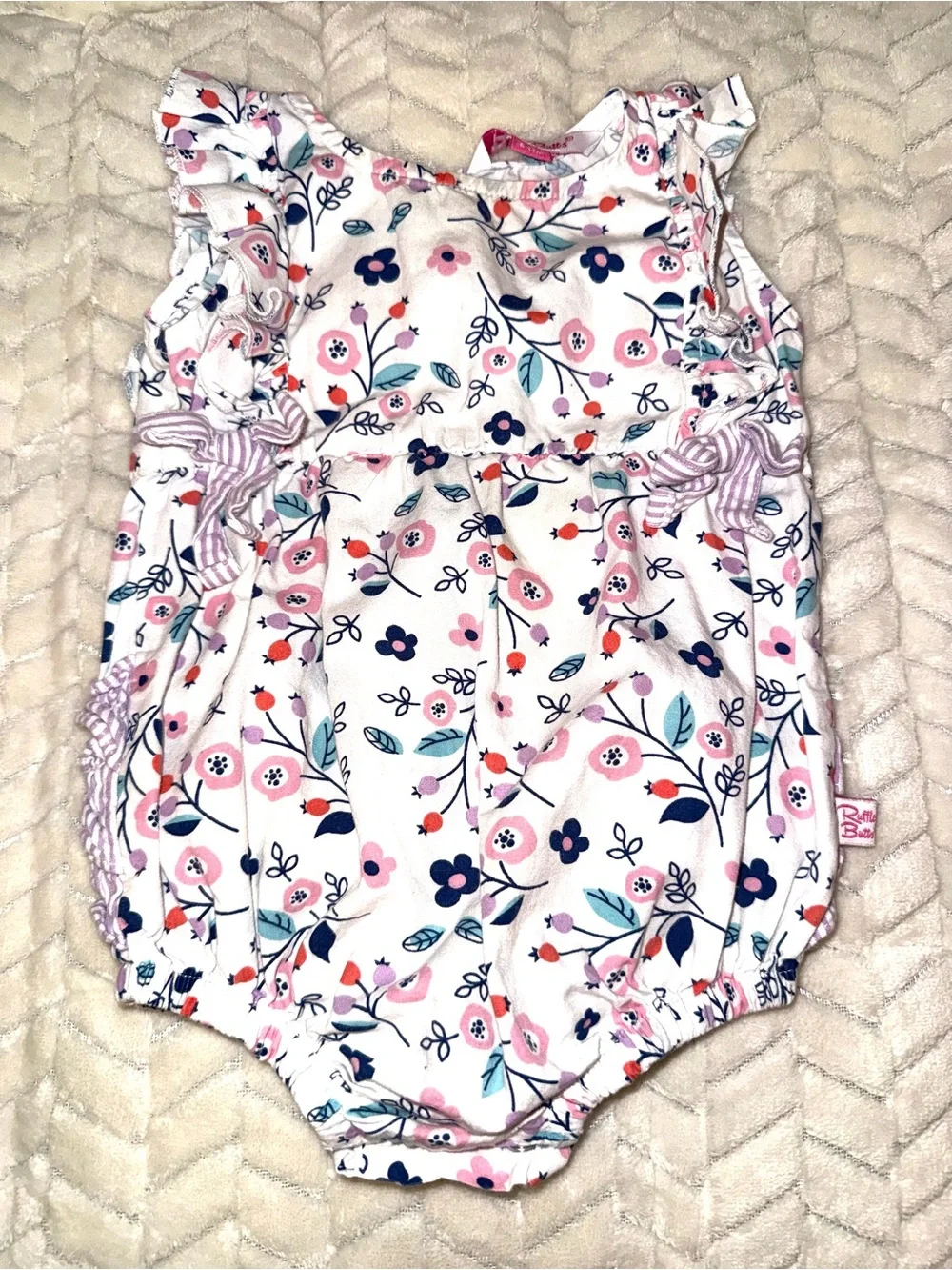 Ruffle Butts floral patterned white baby romper, size 6-12 mos
